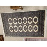 A PERSIAN WOOL RUG 200 X 122 CMS