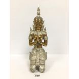 A MIDDLE EASTERN GILT BRONZE FIGURE OF A PRAYING DEITY, POSSIBLY HINDU, WITH SILVERED DETAILING