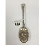 A GEORGE III SILVER TABLE SPOON WITH HIGHLY EMBOSSED AND RIBBED BOWL WITH ENGRAVED, APPEARS TO BE