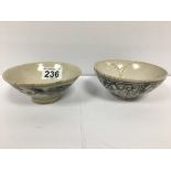 TWO EARLY CHINESE SWATOW PORCELAIN RICE BOWLS OF CIRCULAR FORM RAISED UPON SMALL PEDESTAL BASES,