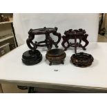 A GROUP OF ORIENTAL WOODEN STANDS/BASES, LARGEST 25CM HIGH