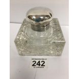 A SILVER TOPPED CUT GLASS INKWELL OF SQUARE FORM, HALLMARKED BIRMINGHAM 1924, MAKERS MARK RUBBED,