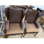 A PAIR OF WINGBACK 1970S CHAIRS