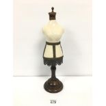 A VINTAGE TABLE TOP MANNEQUIN WITH METAL ON CERAMIC DETAILING, RAISED UPON WOODEN BASE, 46CM HIGH