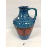 A LARGE WEST GERMAN CERAMIC POURING VESSEL, DECORATED IN VIBRANT RED AND BLUE, NUMBER 218-40, 41CM
