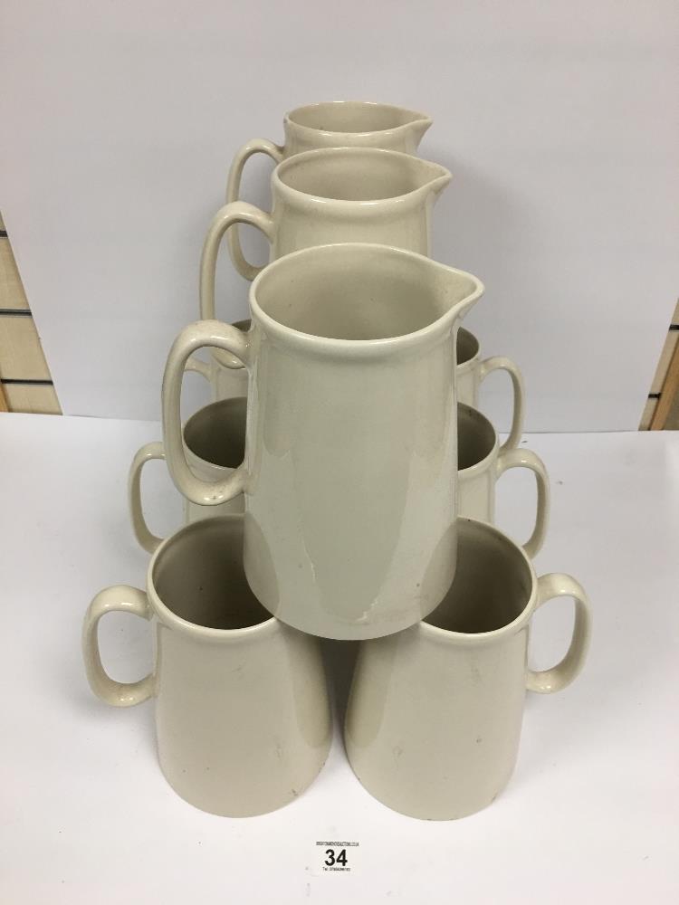 A GROUP OF TEN LARGE CERAMIC WATER JUGS BY HERON CROSS POTTERY, 22.5CM HIGH