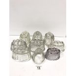 A GROUP OF TEN GLASS JELLY MOULDS, LARGEST 17.5CM LONG