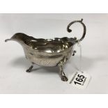 A GEORGE III SILVER SAUCE BOAT RAISED UPON THREE HOOF FEET, HALLMARKED LONDON 1762 BY ALEXANDER