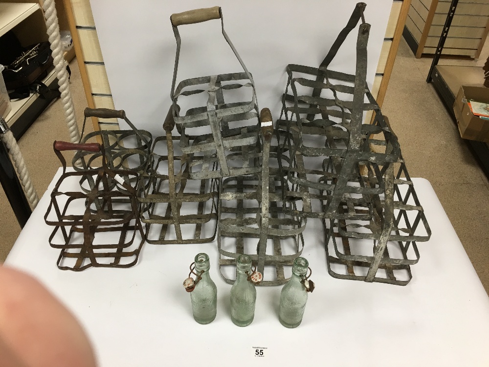 SEVEN VINTAGE MILK BOTTLE CRATES TOGETHER WITH THREE VINTAGE GINGER BEER BOTTLES