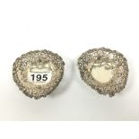 A PAIR OF VICTORIAN SILVER EMBOSSED AND PIERCED BONBON DISHES OF HEART SHAPED FORM, HALLMARKED