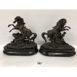 A PAIR OF LATE 19TH/EARLY 20TH CENTURY SPELTER FIGURAL GROUPS DEPICTING A HORSE BY A FEMALE,