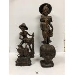 FOUR HARDWOOD ETHNOGRAPHIC CARVED FIGURES, THE LARGEST BEING 59CMS TALL