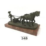 A BRONZE FIGURE GROUP DEPICTING A FARMER WITH HORSE DRAWN PLOUGH, RAISED UPON A MARBLE BASE,