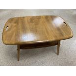 A BLONDE ERCOL COFFEE TABLE PEBBLE STYLE, 73CM WIDE