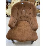 A BROWN VICTORIAN BUTTON BACK UPHOLSTERED CHAIR