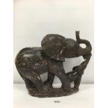 A LARGE SOAPSTONE FIGURE GROUP DEPICTING AN ELEPHANT MOTHER WITH CHILD, INDISTINGCTLY SIGNED TO BASE
