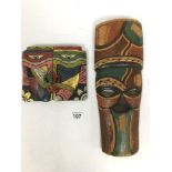 TWO POLYCHROME WOODEN CARVED DECORATIVE TRIBAL MASKS