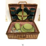A BASKET WEAVE PICNIC BASKET WITH CONTENTS
