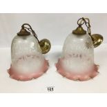 TWO VINTAGE PINK CEILING GLASS SHADES WITH BRASS FITTINGS