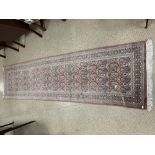 A PERSIAN WOOL RUNNER/CARPET 312 X 82CMS