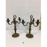 A PAIR OF HEAVY BRASS THREE ARM CANDELABRA