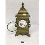 A 19TH CENTURY FRENCH BRONZE MANTLE CLOCK, THE ENAMEL DIAL WITH ARABIC NUMERALS DENOTING HOURS, 34CM