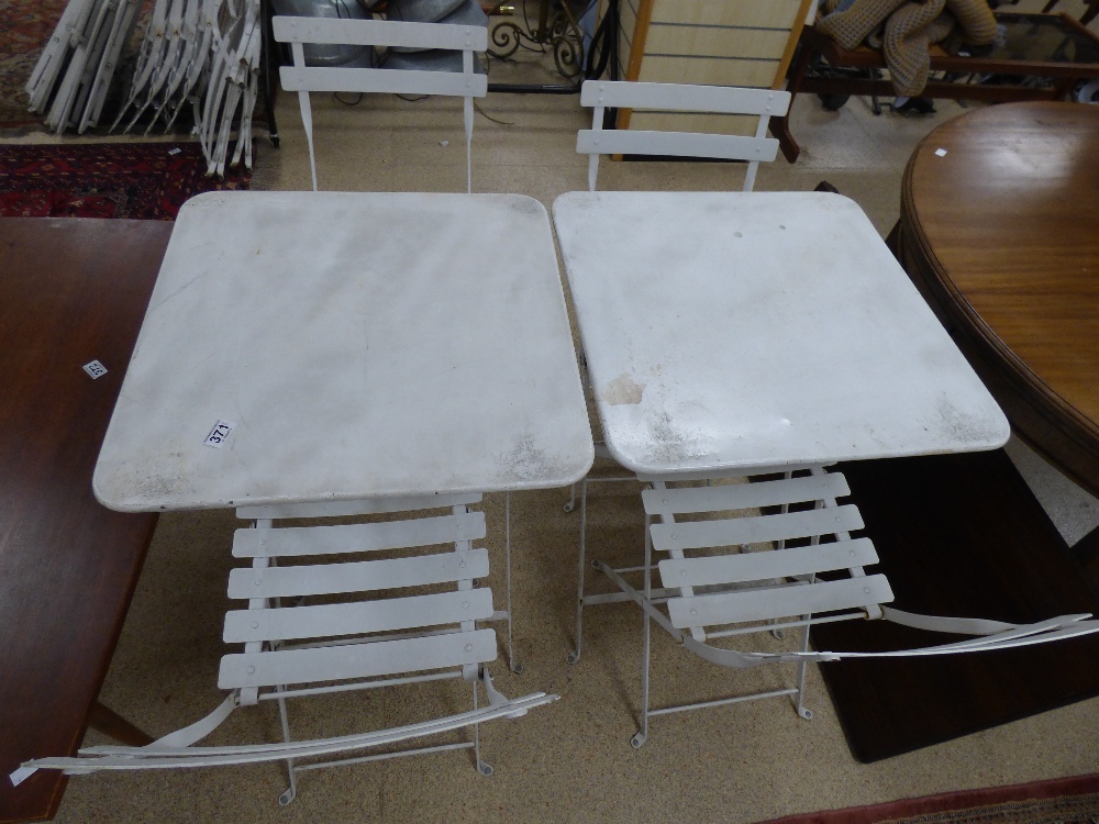 A PAIR OF WHITE METAL GARDEN TABLES WITH FOUR WHITE METAL CHAIRS, ALL FOLDING