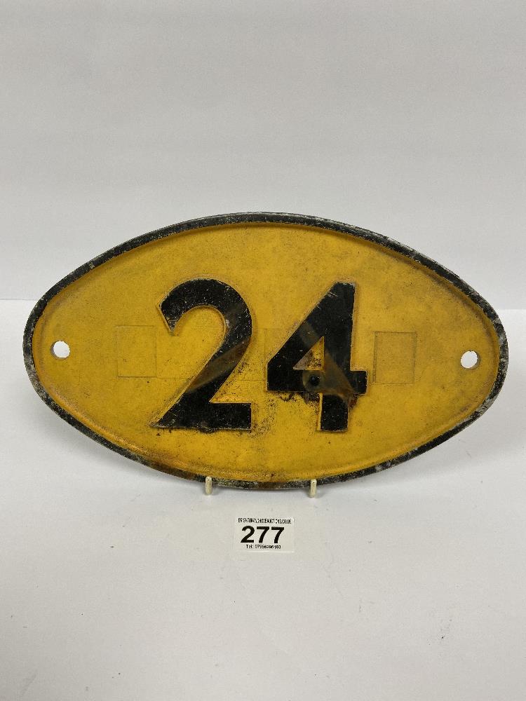 A CAST METAL RAILWAY SIGNALLING SIGN "24" YELLOW GROUND WITH BLACK LETTERING, 31CM WIDE BY 18CM