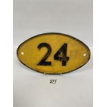 A CAST METAL RAILWAY SIGNALLING SIGN "24" YELLOW GROUND WITH BLACK LETTERING, 31CM WIDE BY 18CM