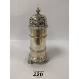 A HIGHLY DETAILED SILVER SUGAR CASTOR OF CYLINDRICAL FORM BY HARRODS, RAISED UPON THREE CLAW AND