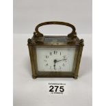 A FRENCH BRASS CARRIAGE CLOCK OF RECTANGULAR FORM, THE ENAMEL DIAL WITH ARABIC NUMERALS DENOTING