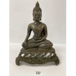 AN ORIENTAL BRONZE FIGURE OF BUDDHA IN A SEATED POSITION, RAISED UPON THREE FOOTED BASE WITH PIERCED