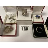 SEVEN ASSORTED SILVER DRESS RINGS IN FIVE BOXES