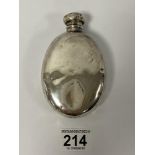A SILVER HIP FLASK OF OVAL FORM WITH SCREW CAP, HALLMARKS RUBBED, 12CM WIDE, 93G