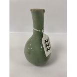 A PROTO-CELADON GLAZED POTTERY BOTTLE VASE, BLACK PAINTED CHARACTER MARK TO BASE, BELIEVED TO BE A