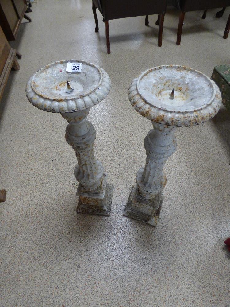 A PAIR OF METAL CANDLESTICKS, 70CMS