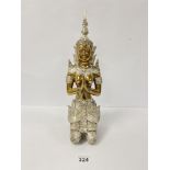 A MIDDLE EASTERN GILT BRONZE FIGURE OF A PRAYING DEITY, POSSIBLY HINDU, WITH SILVERED DETAILING