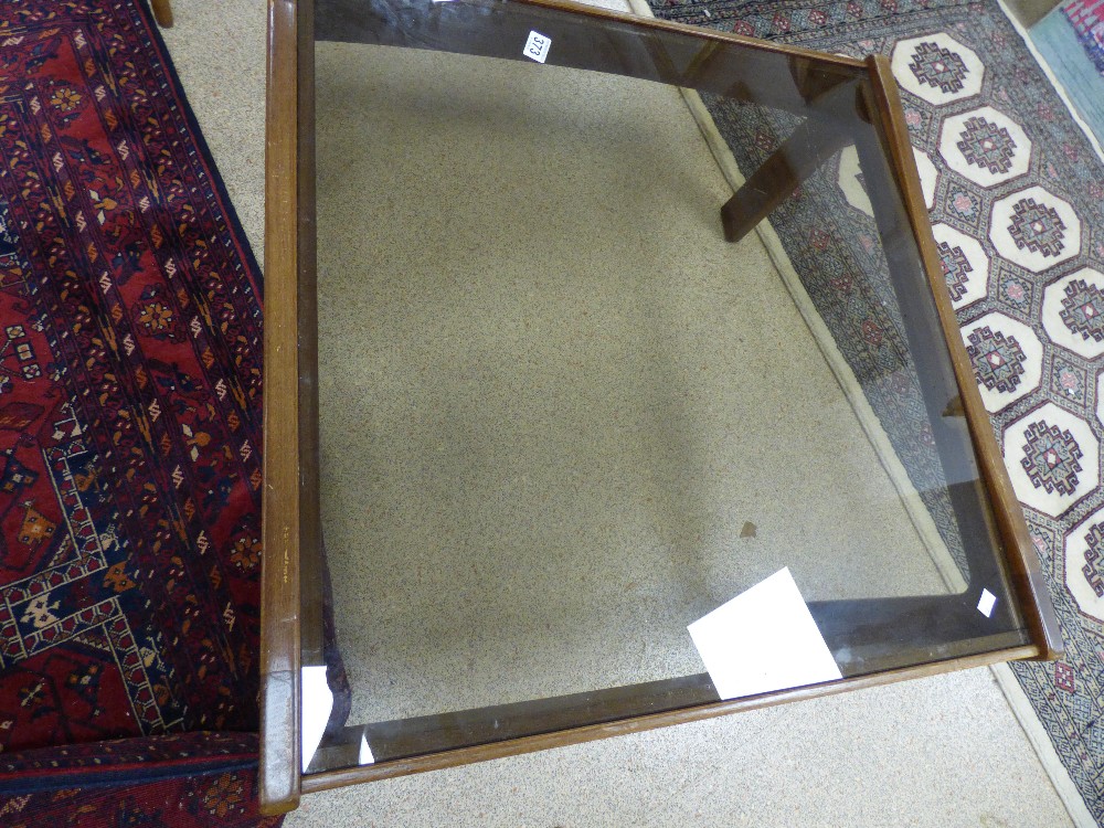 A MID CENTURY SMOKED GLASS COFFEE TABLE, 84CM BY 79CM BY 40CM