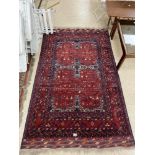 A COLOURFUL PERSIAN AFGHAN RUG, 195CM BY 125CM