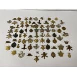 A LARGE COLLECTION OF MILITARY CAP BADGES AND OTHERS FROM NUMEROUS DIFFERENT REGIMENTS, 78 IN TOTAL