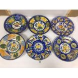 SIX LATE 19TH/EARLY 20TH CENTURY CONTINENTAL TIN GLAZED CHARGERS OF CIRCULAR FORM, EACH DECORATED