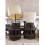 A PAIR OF LARGE UNUSUAL TABLE LAMPS FORMED OUT OF WOODEN CARTWHEEL WAGON WHEEL HUBS WITH COOPERED