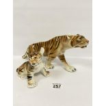 TWO CZECHOSLOVAKIAN PORCELAIN FIGURES OF A TIGER MOTHER A CUB, PROBABLY BY ROYAL DUX, THE MOTHER