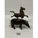 A SMALL BRONZE FIGURE OF A COW/YAK WITH LARGE HORNS, 15CM LONG, TOGETHER WITH A BRONZED FIGURE OF