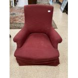 A VINTAGE LOUNGER CHAIR IN A DEEP RED COVER