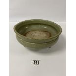 A MING DYNASTY CHINESE CELADON CENSER RAISED UPON THREE MYTHICAL BEAST FEET, 27.5CM IN DIAMETER (