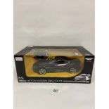 A LARGE DIE CAST RC ASTON MARTIN DBS COUPE BY RASTAR, 1/14 SCALE, IN ORIGINAL BOX