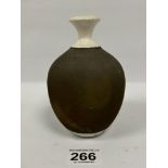 AN UNUSUAL ART POTTERY VASE OF OVOID FORM, MARKED TO BASE "CH", 15CM HIGH