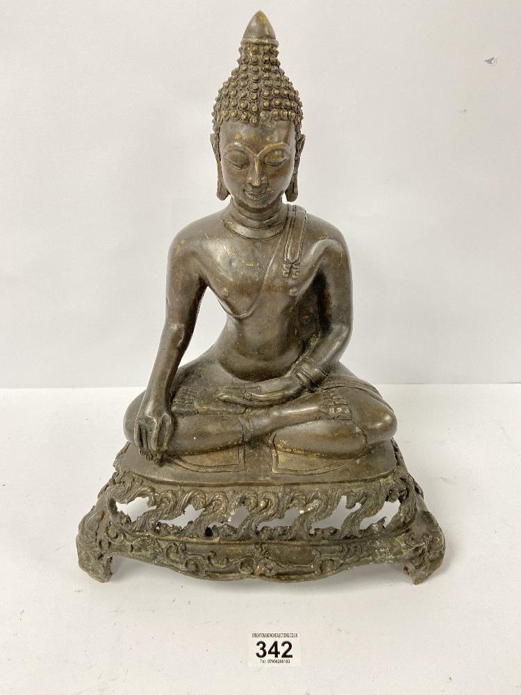 AN ORIENTAL BRONZE FIGURE OF BUDDHA IN A SEATED POSITION, RAISED UPON A THREE FOOTED BASE, 40CM