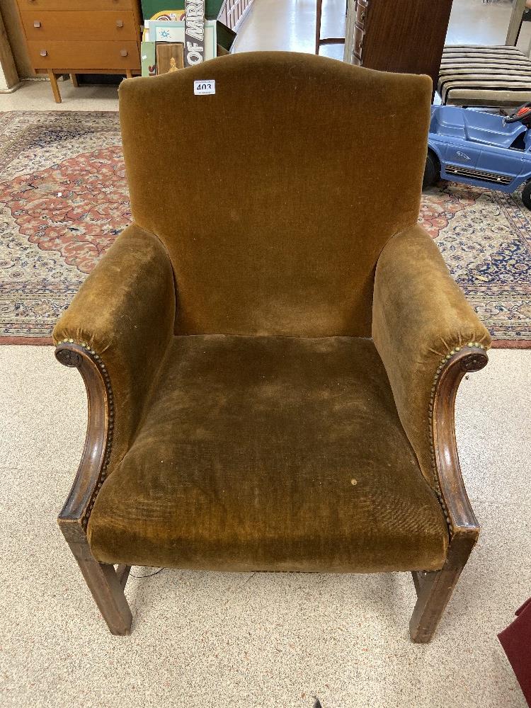 AN EDWARDIAN BROWN VELVET ARMCHAIR